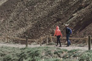 hiking-couple-walking-near-mountain